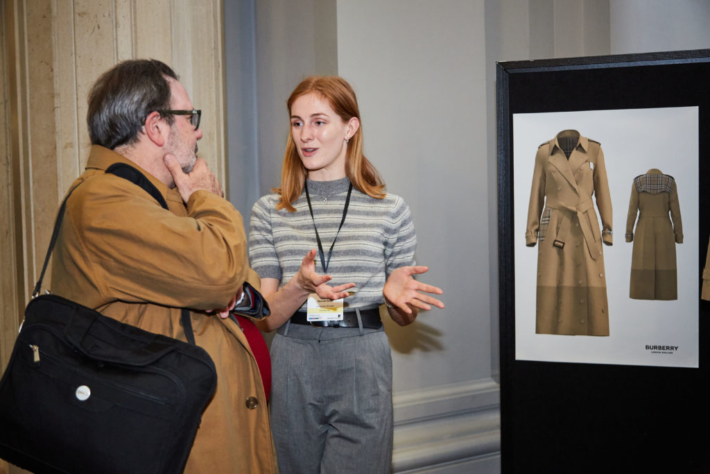 Hannah Dean talks through designs from the Burberry 'hackathon' at a special event hosted by UK Research and Innovation in 2019