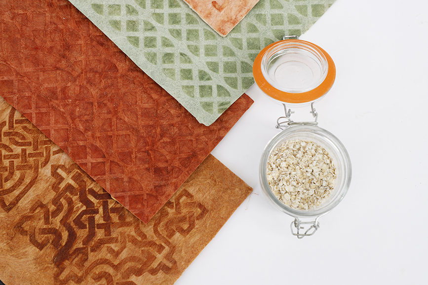 Brown, terracotta and pale green samples of flax leather, featuring Celtic design motifs