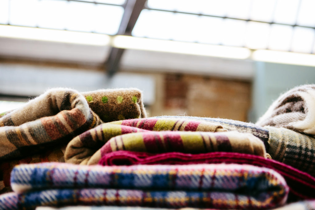 Pile of folded checked pattern blankets