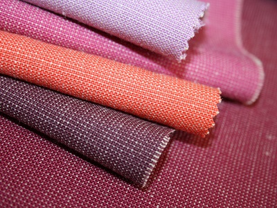 Folded samples of pink and purple fabrics